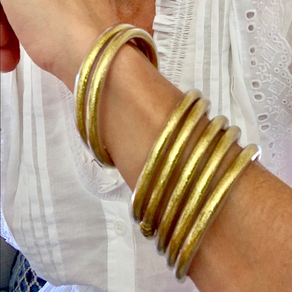 Set of gold, silver, and geometric bracelets